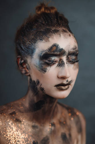 Halloween make up. Portrait pale gothic daemon woman.