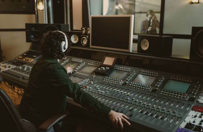 sound producer working at studio while recording song sound producer working at studio while recording song