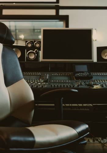 armchair in front of graphic equalizer at recording studio armchair in front of graphic equalizer at recording studio